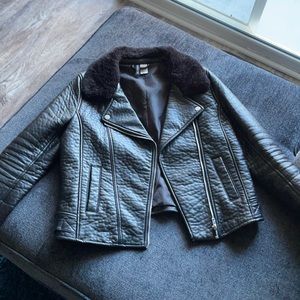 Leather jacket with fur collar